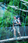 The author crossing one of the many hanging bridges the team encountered. © Renzo Uccelli